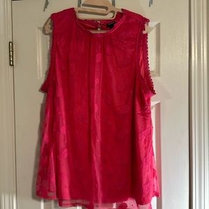 Cute dressy tank top with pineapples embroidered on the shell of the shirt